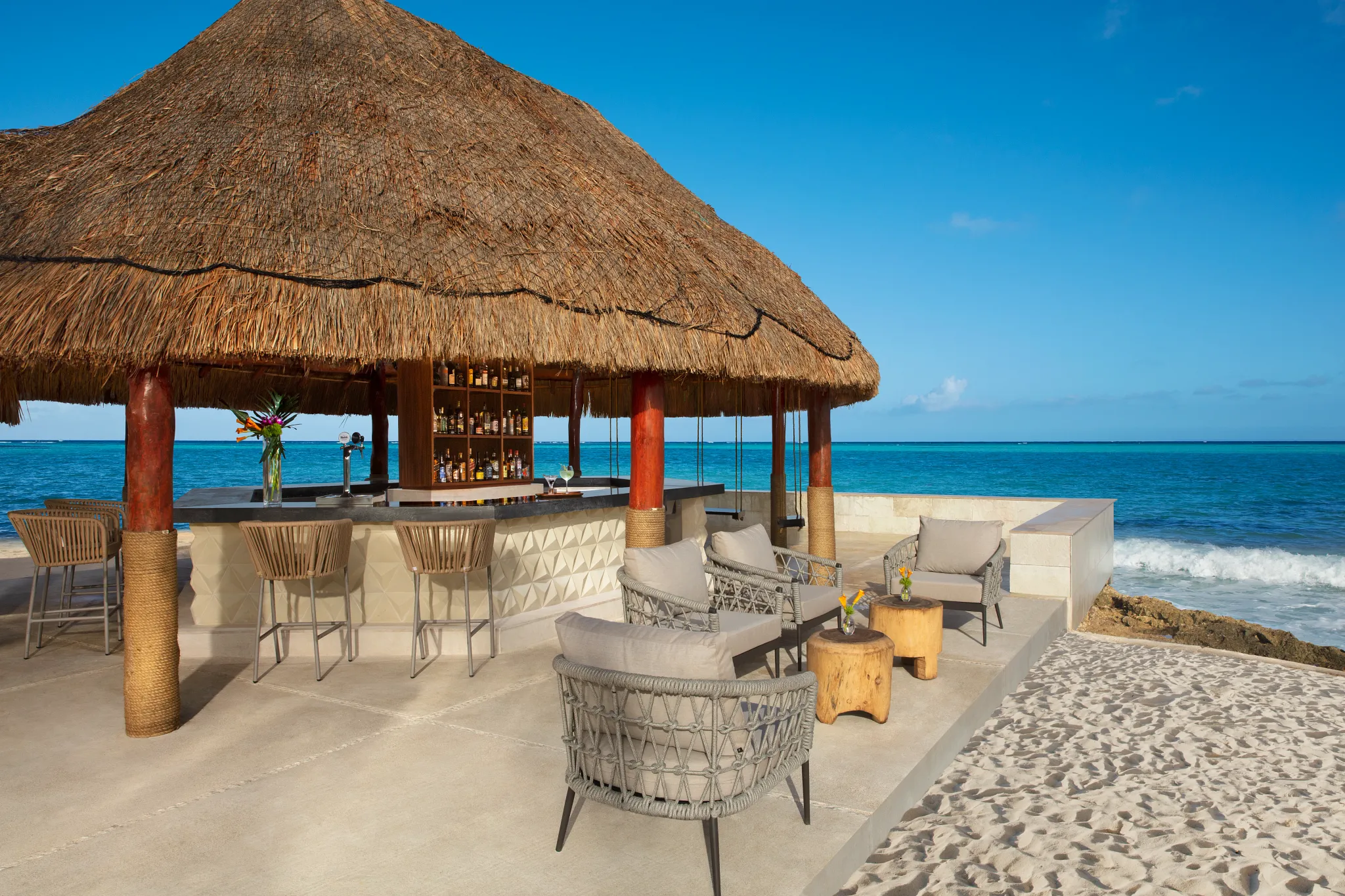 Barracuda beachfront restaurant at Dreams Aventuras Riviera Maya featuring open-air dining, ocean views, and a relaxed tropical atmosphere.