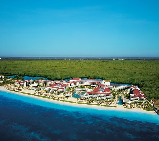 Breathless Riviera Cancun adults-only all-inclusive resort with vibrant pool parties, modern design, and beachfront nightlife atmosphere.