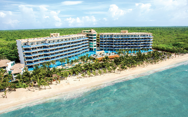 El Dorado Seaside Suites adults-only all-inclusive resort with oceanfront infinity pools, swim-up suites, and romantic beachfront setting.