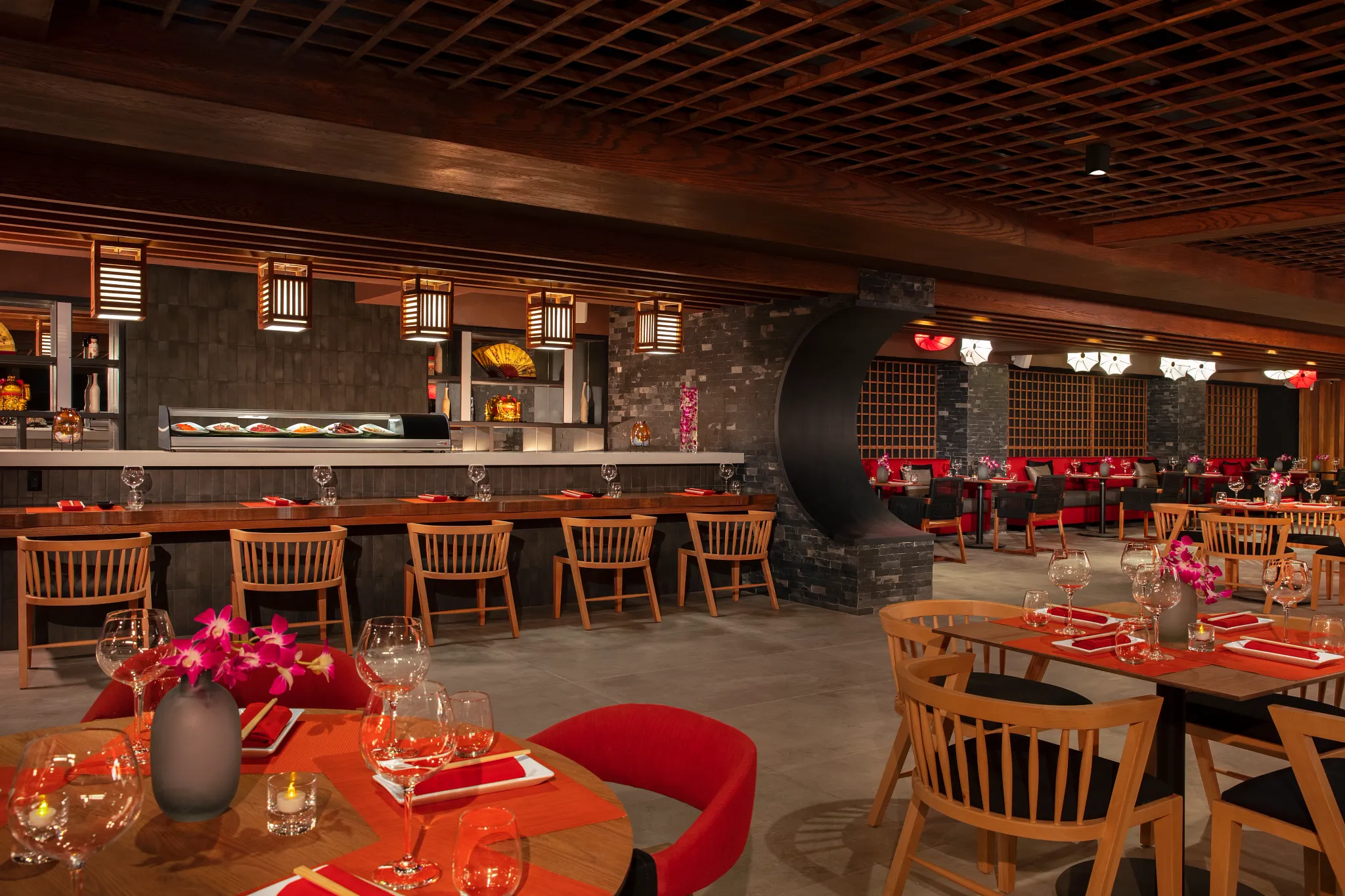 Gohan restaurant at Dreams Aventuras Riviera Maya featuring a sleek teppanyaki grill, modern Asian décor, and interactive dining experience.