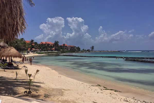 Oasis Beach near Dreams Aventuras Riviera Maya with soft sand, clear turquoise waters, and relaxing coastal views