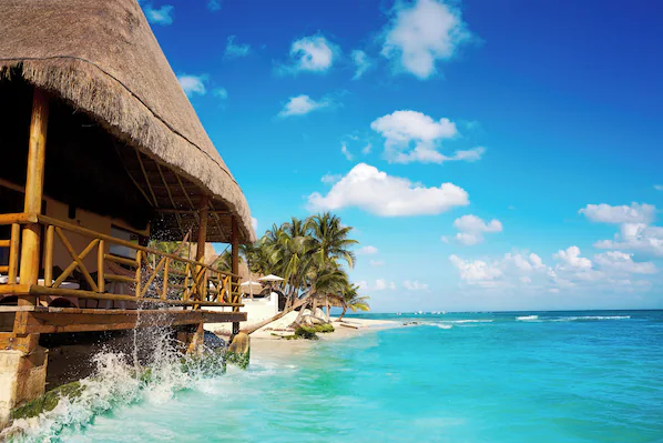 Playa del Carmen Main Beach near Dreams Aventuras Riviera Maya with vibrant shoreline, turquoise waters, and lively beachfront atmosphere