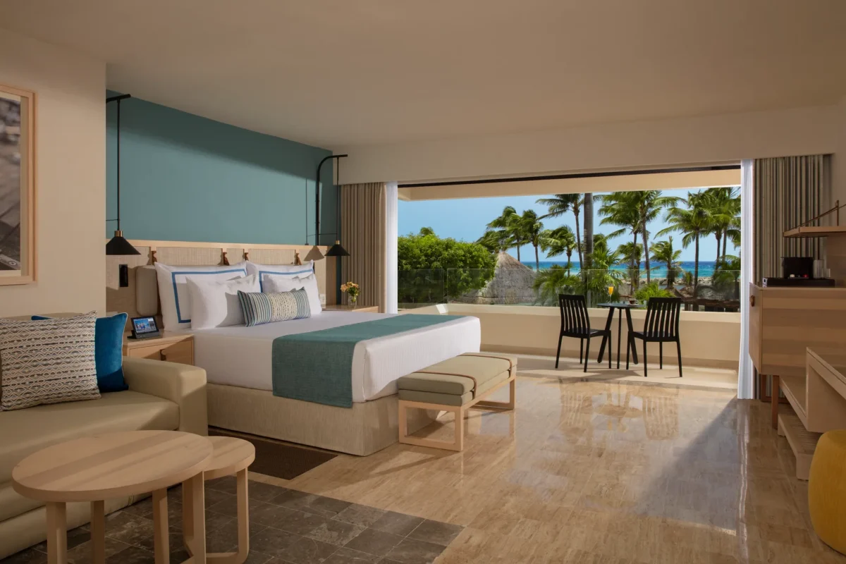 Preferred Club Family Room Pool View with two double beds and private balcony at Dreams Aventuras Riviera Maya.