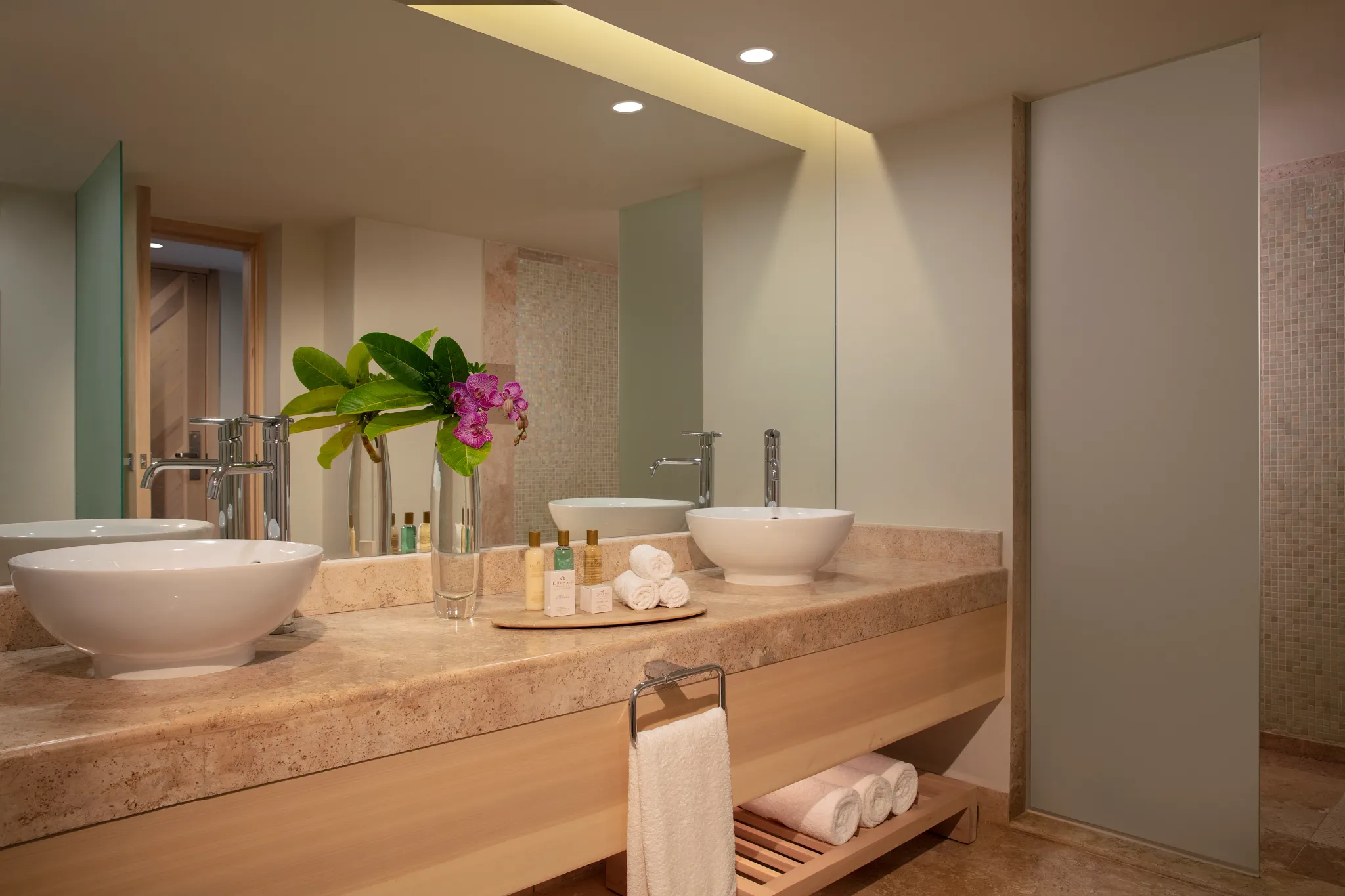Preferred Club Honeymoon bathroom with double vessel sinks and modern vanity at Dreams Aventuras Riviera Maya.