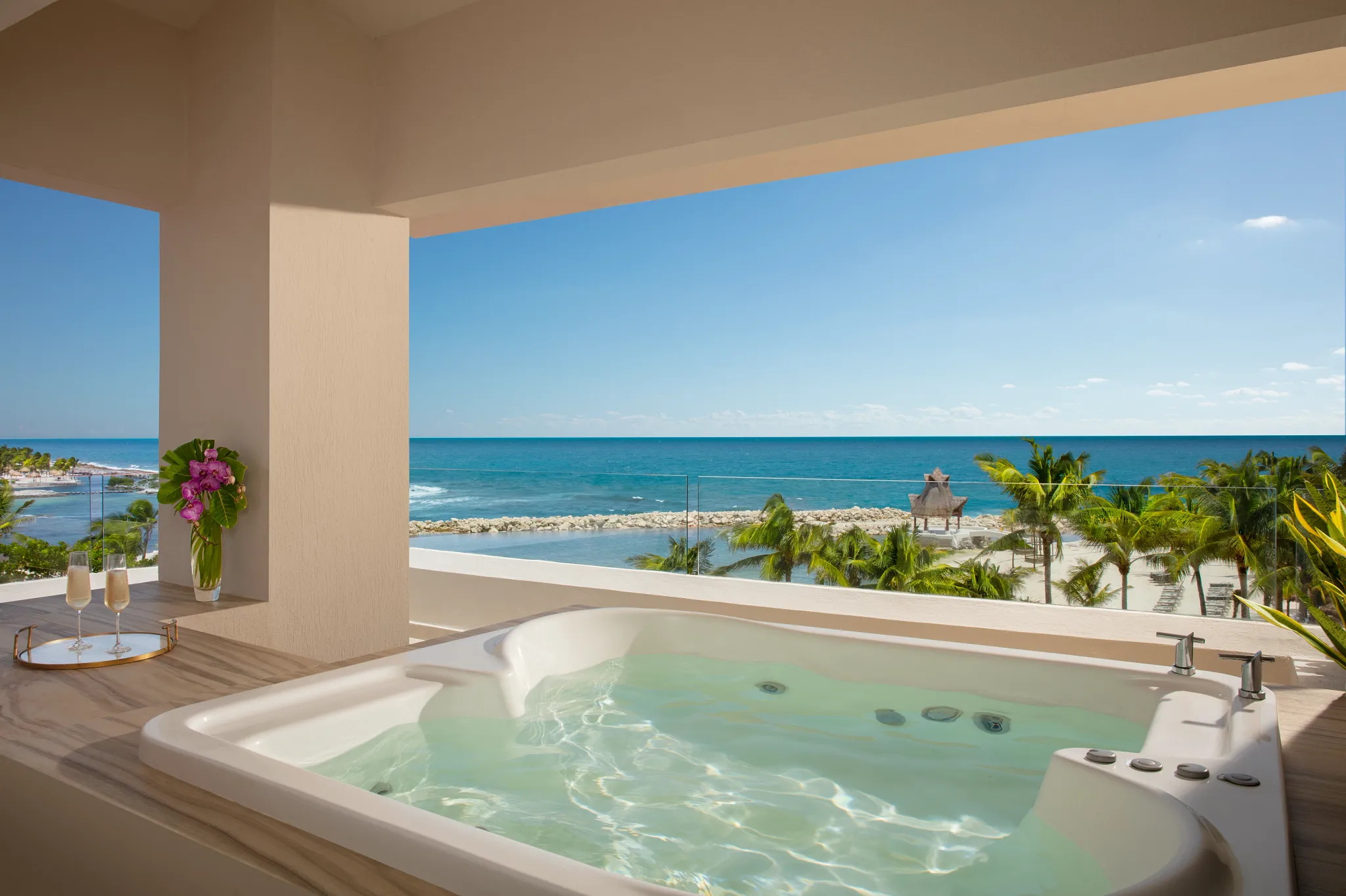 Preferred Club Honeymoon terrace with hot tub and ocean view at Dreams Aventuras Riviera Maya.
