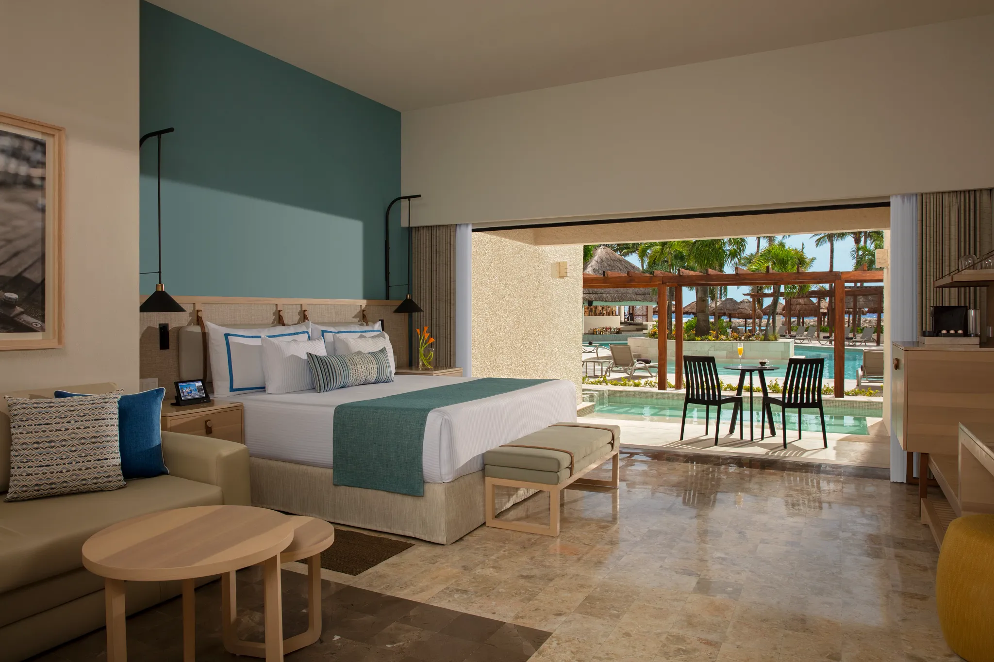 Preferred Club Swim Out room with king bed and direct pool access at Dreams Aventuras Riviera Maya.