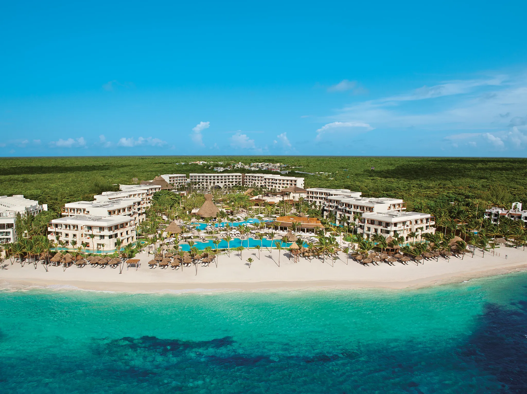 Secrets Maroma Beach adults-only luxury all-inclusive resort with pristine white sand beach, turquoise waters, and romantic atmosphere in Riviera Maya.